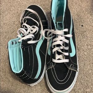 Baby blue and black high top vans